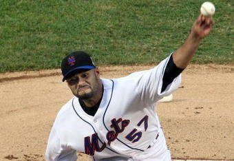 NEW YORK - AUGUST 20:  Johan Santana #57 of the New York Mets delivers a pitch against the Atlanta Braves on August 20, 2009 at Citi Field in the Flushing neighborhood of the Queens borough of New York City.  (Photo by Jim McIsaac/Getty Images)