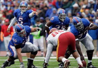 LAWRENCE, KS - OCTOBER 10: Quarterback Todd Reesing #5 and center Sal Capra #59 of the Kansas Jayhawks point out the defense during the game against the Iowa State Cyclones on October 10, 2009 at Memorial Stadium in Lawrence, Kansas. (Photo by Jamie Squire/Getty Images)