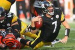 PITTSBURGH - NOVEMBER 15: Ben Roethlisberger #7 of the Pittsburgh Steelers is sacked by Jonathan Fanene #68 of the Cincinnati Bengals at Heinz Field on November 15, 2009 in Pittsburgh, Pennsylvania.  (Photo by Rick Stewart/Getty Images)
