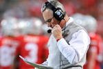 COLUMBUS, OH - NOVEMBER 14:  Head coach Jim Tressel of the Ohio State Buckeyes checks his notes as the Buckeyes play the Iowa Hawkeyes at Ohio Stadium on November 14, 2009 in Columbus, Ohio.  (Photo by Jamie Sabau/Getty Images)
