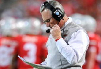 COLUMBUS, OH - NOVEMBER 14:  Head coach Jim Tressel of the Ohio State Buckeyes checks his notes as the Buckeyes play the Iowa Hawkeyes at Ohio Stadium on November 14, 2009 in Columbus, Ohio.  (Photo by Jamie Sabau/Getty Images)