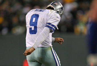 GREEN BAY, WI - NOVEMBER 15: Tony Romo #9 of the Dallas Cowboys kicks the dirt as he leaves the field after throwing an interception at the goal line against the Green Bay Packers at Lambeau Field on November 15, 2009 in Green Bay, Wisconsin. The Packers defeated the Cowboys 17-7. (Photo by Jonathan Daniel/Getty Images)
