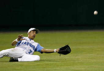 OMAHA, NE - JUNE 24:  Leftfielder Reid Fronk #7 of the North Carolina Tar Heels attempts to make a sliding catch in the outfield during their 9-3 loss to the Oregon State Beavers in Game 2 of the NCAA College World Series Championship at Rosenblatt Stadium on June 24, 2007 in Omaha, Nebraska. (Photo by Kevin C. Cox/Getty Images)