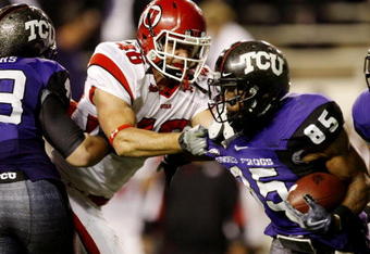 FORT WORTH, TX - NOVEMBER 14:  Lolo Tenifa #46 of the Utah Utes tries to stop Jeremy Kerley #85 of the TCU Horned Frogs at Amon G. Carter Stadium on November 14, 2009 in Fort Worth, Texas.  (Photo by Ronald Martinez/Getty Images)