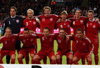 COPENHAGEN, DENMARK - OCTOBER 14:  Denmark players pose for a group photograph after the national anthem during the FIFA 2010 group one World Cup Qualifying match between Denmark and Hungary at the Parken stadium on October 14, 2009 in Copenhagen, Denmark.  (Photo by Clive Brunskill/Getty Images)