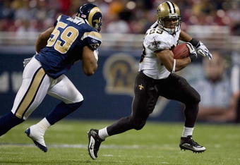 ST. LOUIS - NOVEMBER 15: Pierre Thomas #23 of the New Orleans Saints rushes against the St. Louis Rams at the Edward Jones Dome on November 15, 2009 in St. Louis, Missouri.  The Saints beat the Rams 28-23.  (Photo by Dilip Vishwanat/Getty Images)