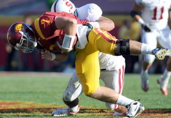 LOS ANGELES, CA - NOVEMBER 14:  Matt Barkley #7 of the USC Trojans is sacked by Will Powers #42 of the Stanford Cardinal during the second half at the Los Angeles Memorial Coliseum on November 14, 2009 in Los Angeles, California.  Stanford won 55-21.   (Photo by Harry How/Getty Images)