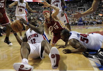 AUBURN HILLS, MI - APRIL 26: Will Bynum #12 of the Detroit Pistons tries to pass to a teammate but his foot was out of bounds in front of Delonte West #13 of the Cleveland Cavaliers in Game Four of the Eastern Conference Quarterfinals during the 2009 NBA Playoffs at the Palace of Auburn Hills on April 26, 2009 in Auburn Hills, Michigan. NOTE TO USER: User expressly acknowledges and agrees that, by downloading and or using this photograph, User is consenting to the terms and conditions of the Getty Images License Agreement.  (Photo by Gregory Shamus/Getty Images)