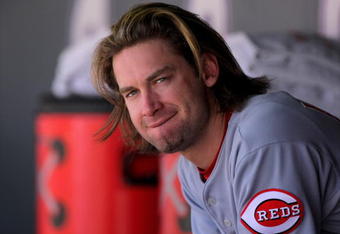 DENVER - SEPTEMBER 07:  Bronson Arroyo #61 of the Cincinnati Reds looks on from the dugout against the Colorado Rockies at Coors Field on September 7, 2009 in Denver, Colorado. The Rockies defeated the Reds 4-3.  (Photo by Doug Pensinger/Getty Images)