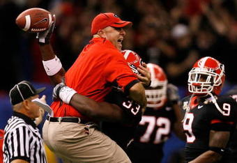 NEW ORLEANS - JANUARY 01:  Defensive coordinator Willie Martinez and Dannell Ellerbe #33 of the Georgia Bulldogs celebrate after Ellerbe intercepted the ball against the Hawai'i Warriors during the Allstate Sugar Bowl at the Louisiana Superdome on January 1, 2008 in New Orleans, Louisiana. Georgia won 41-10. (Photo by Kevin C. Cox/Getty Images)
