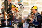 AVONDALE, AZ - NOVEMBER 15:  Jimmie Johnson (R), driver of the #48 Lowe's Chevrolet, and his crew celebrate in victory lane with champagne after winning the NASCAR Sprint Cup Series Checker O'Reilly Auto Parts 500 at Phoenix International Raceway on November 15, 2009 in Avondale, Arizona.  (Photo by Jason Smith/Getty Images for NASCAR)