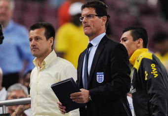DOHA, QATAR - NOVEMBER 14: England manager Fabio Capello and Brazil manager Dunga look on during the International Friendly match between Brazil and England at the Khalifa Stadium on November 14, 2009 in Doha, Qatar.  (Photo by Michael Regan/Getty Images)