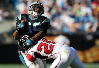 CHARLOTTE, NC - NOVEMBER 15:  Brent Grimes #20 of the Atlanta Falcons tackles Steve Smith #89 of the Carolina Panthers during their game at Bank of America Stadium on November 15, 2009 in Charlotte, North Carolina.  (Photo by Streeter Lecka/Getty Images)