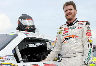 CONCORD, NC - MAY 15:  Dale Earnhardt Jr., driver of the #88 Dale Jr. Foundation-AMP Energy/National Guard Chevrolet stands next to his car during qualifying for the NASCAR Sprint All-Star Race on May 15, 2009 at Lowe's Motor Speedway in Concord, North Carolina.  (Photo by John Harrelson/Getty Images)
