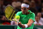 PARIS - NOVEMBER 12:  Rafael Nadal of Spain in action during his match against Tommy Robredo of Spain during the ATP Masters Series at the Palais Omnisports De Paris-Bercy on November 12, 2009 in Paris, France.  (Photo by Clive Rose/Getty Images)