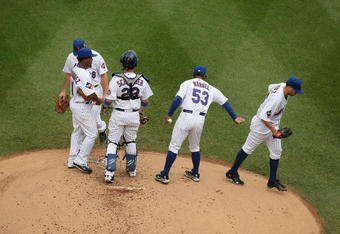 NEW YORK - AUGUST 23:  Oliver Perez #46 of the New York Mets is taken out of the game in the first inning by Manager Jerry Manuel after giving up 6 runs to  the Philadelphia Phillies during their game on August 23, 2009 at Citi Field in the Flushing neighborhood of the Queens borough of New York City.  (Photo by Al Bello/Getty Images)