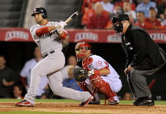 ANAHEIM, CA - OCTOBER 08:  Alex Gonzalez #3 of the Boston Red Sox singles against the Los Angeles Angels of Anaheim in the third inning of Game One of the ALDS during the 2009 MLB Playoffs at Angel Stadium on October 8, 2009 in Anaheim, California.  (Photo by Lisa Blumenfeld/Getty Images)
