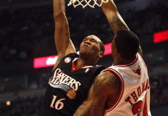 CHICAGO - DECEMBER 02:  Marreese Speights #16 of the Philadelphia 76ers attempts a shot against Tyrus Thomas #24 of the Chicago Bulls at the United Center on December 2, 2008 in Chicago, Illinois.  NOTE TO USER: User expressly acknowledges and agrees that, by downloading and/or using this Photograph, user is consenting to the terms and conditions of the Getty Images License Agreement.  (Photo by Jonathan Daniel/Getty Images)