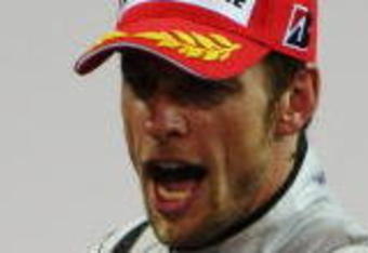 ABU DHABI, UNITED ARAB EMIRATES - NOVEMBER 01:  Jenson Button of Great Britain and Brawn GP celebrates on the podium after finishing third during the Abu Dhabi Formula One Grand Prix at the Yas Marina Circuit on November 1, 2009 in Abu Dhabi, United Arab Emirates.  (Photo by Mark Thompson/Getty Images)