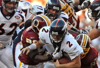 LANDOVER, MD - NOVEMBER 15:  Chris Simms #2 of the Denver Broncos is sacked during the game against the Washington Redskins at FedExField on November 15, 2009 in Landover, Maryland. The Redskins defeated the Broncos 27-17. (Photo by Larry French/Getty Images)