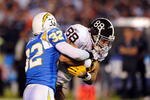 SAN DIEGO - OCTOBER 19:  Eric Weddle #32 of the San Diego Chargers takes down Tony Scheffler #88 of the Denver Broncos at Qualcomm Stadium on October 19, 2009 in San Diego, California.  (Photo by Jacob de Golish/Getty Images)