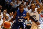 CHAPEL HILL, NC - MARCH 8:  Elliot Williams #20 of the Duke Blue Devils drives to the basket against Wayne Ellington #22 of the North Carolina Tar Heels during the game at the Dean E. Smith Center on March 8, 2009 in Chapel Hill, North Carolina. (Photo by Streeter Lecka/Getty Images)