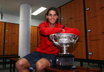 MELBOURNE, AUSTRALIA - FEBRUARY 01:  Rafael Nadal of Spain poses with the Norman Brookes Challenge Cup in the players locker room after winning the men's final match against Roger Federer of Switzerland during day fourteen of the 2009 Australian Open at Melbourne Park on  February 1, 2009 in Melbourne, Australia.  (Photo by Clive Brunskill/Getty Images)