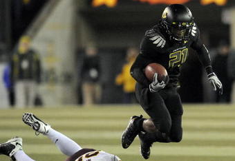 EUGENE,OR - NOVEMBER 14: Running back LaMichael James #21of the Oregon Ducks leaps over the the tackle of linebacker Mike Nixon #25 of the Arizona State Sun Devils in the first quarter of the game at Autzen Stadium on November 14, 2009 in Eugene, Oregon. James has 118 yards and 3 touchdowns in the first half of the game. (Photo by Steve Dykes/Getty Images)
