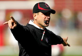 PALO ALTO, CA - NOVEMBER 07:  Stanford Cardinal head coach Jim Harbaugh instructs his team during warmups before their game against the Oregon Ducks at Stanford Stadium on November 7, 2009 in Palo Alto, California.  (Photo by Ezra Shaw/Getty Images)