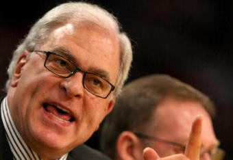 LOS ANGELES, CA - NOVEMBER 25: Head coach Phil Jackson of the Los Angeles Lakers makes a point with the officials in the game with the New Jersey Nets on November 25, 2008 at Staples Center in Los Angeles, California. The Lakers won 120-93.   NOTE TO USER: User expressly acknowledges and agrees that, by downloading and/or using this Photograph, user is consenting to the terms and conditions of the Getty Images License Agreement.  (Photo by Stephen Dunn/Getty Images)