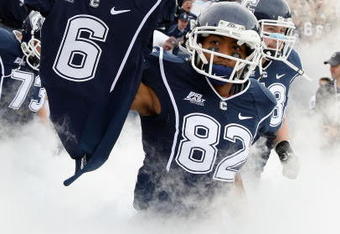 EAST HARTFORD, CT - OCTOBER 31:  Kashif Moore #82 of the Connecticut Huskies carries out the jersey of murdered teammate Jasper Howard #6 before the game against the Rutgers Scarlet Knights on October 31, 2009 at Rentschler Field in East Hartford, Connecticut.  (Photo by Elsa/Getty Images)