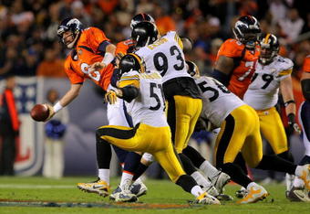 DENVER - NOVEMBER 09:  Quarterback Kyle Orton #8 of the Denver Broncos attempts to deliver a pass to avoid a sack against the Pittsburgh Steelers on during NFL action at Invesco Field at Mile High on November 9, 2009 in Denver, Colorado. The Steelers defeated the Broncos 28-10.  (Photo by Doug Pensinger/Getty Images)