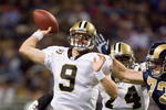 ST. LOUIS - NOVEMBER 15: Drew Brees #9 of the New Orleans Saints passes against the St. Louis Rams at the Edward Jones Dome on November 15, 2009 in St. Louis, Missouri.  (Photo by Dilip Vishwanat/Getty Images)