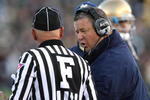 SOUTH BEND, IN - OCTOBER 17: Head coach Charlie Weis of the Notre Dame Fighting Irish talks with a referee during a game against the USC Trojans at Notre Dame Stadium on October 17, 2009 in South Bend, Indiana. USC defeated Notre Dame 34-27.  (Photo by Jonathan Daniel/Getty Images)