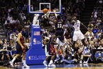 ORLANDO, FL - NOVEMBER 11:  LeBron James #23 of the Cleveland Cavaliers goes to the basket against Brandon Bass #30 of the Orlando Magic during the game on November 11, 2009 at Amway Arena in Orlando, Florida. NOTE TO USER: User expressly acknowledges and agrees that, by downloading and/or using this Photograph, user is consenting to the terms and conditions of the Getty Images License Agreement. (Photo by Sam Greenwood/Getty Images)