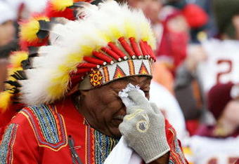 LANDOVER, MD - DECEMBER 02:  Washington Redskins fan 'Chief Zee' fights back tears during a pre game ceremony honoring the late Sean Taylor before the game against the Buffalo Bills on December 2, 2007 at FedEx Field in Landover, Maryland.  (Photo by Jim McIsaac/Getty Images)