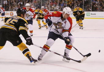 BOSTON - NOVEMBER 12:  Stephen Weiss #9 of the Florida Panthers tries to keep the puck from Mark Stuart #45 of the Boston Bruins on November 12, 2009 at the TD Garden in Boston, Massachusetts.  (Photo by Elsa/Getty Images)