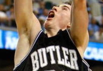 GREENSBORO, NC - MARCH 19:  Garrett Temple #14 of the Louisiana State University Tigers blocks a shot by Gordon Hayward #20 of the Butler Bulldogs during the first round of the NCAA Division I Men's Basketball Tournament at the Greensboro Coliseum on March 19, 2009 in Greensboro, North Carolina.  (Photo by Streeter Lecka/Getty Images)