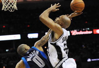 SAN ANTONIO - NOVEMBER 11:  Shawn Marion #0 of the Dallas Mavericks fouls Richard Jefferson #24 of the San Antonio Spurs in the act of shooting during second quarter of action at AT&T Center on November 11, 2009 in San Antonio, Texas.  NOTE TO USER: User expressly acknowledges and agrees that, by downloading and or using this photograph, User is consenting to the terms and conditions of the Getty Images License Agreement. (Photo by Ronald Martinez/Getty Images)