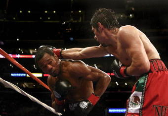 LOS ANGELES - JANUARY 24:   Shane Mosley dodges a punch from Antonio Margarito en route to Mosley's TKO in the ninth round after Margarito's corner threw in the towel during their WBA welterweight title fight on January 24, 2009 at the Staples Center in Los Angeles, California. (Photo by Donald Miralle/Getty Images)
