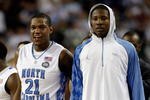 DETROIT - APRIL 06:  Deon Thompson #21 and Ed Davis #32 of the North Carolina Tar Heels look on from the bench late in the second half before the Tar Heels 89-72 win against the Michigan State Spartans during the 2009 NCAA Division I Men's Basketball National Championship game at Ford Field on April 6, 2009 in Detroit, Michigan. Ginyard used a medical red-shirt this season after injury.  (Photo by Andy Lyons/Getty Images)