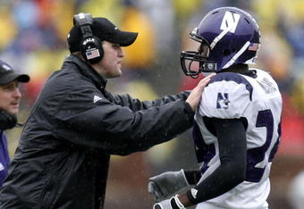 ANN ARBOR, MI - OCTOBER 28:  Head coach Pat Fitzgerald of the Northwestern Wildcats talks with Kevin Mitchell #24 during a game against the Michigan Wolverines on October 28, 2006 at Michigan Stadium in Ann Arbor, Michigan. Michigan defeated Northwestern 17-3.  (Photo by Gregory Shamus/Getty Images)