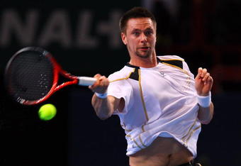 PARIS - NOVEMBER 13:  Robin Soderling of Sweden in action during his match against Novak Djokovic of Serbia during the ATP Masters Series at the Palais Omnisports De Paris-Bercy on November 13, 2009 in Paris, France.  (Photo by Clive Rose/Getty Images)