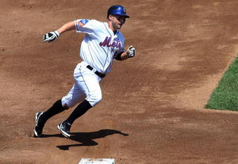 NEW YORK - JULY 12:  David Wright #5 of the New York Mets scores a run in the third inning against the Cincinnati Reds on July 12, 2009 at Citi Field in the Flushing neighborhood of the Queens borough of New York City.  (Photo by Jim McIsaac/Getty Images)