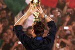 ROME, ITALY - JULY 10: Italian soccer fans celebrate as the Italian team displays the FIFA World Cup Trophy at the Circo Massimo on July 10, 2006 in Rome, Italy. (Photo by Salvatore Laporta/Getty Images)