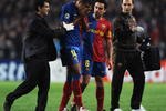 BARCELONA, SPAIN - APRIL 28:  Captain Xavi (2R) looks on asThierry Henry of Barcelona is injured during the UEFA Champions League Semi Final First Leg match between Barcelona and Chelsea at the Nou Camp Stadium on April 28, 2009 in Barcelona, Spain.  (Photo by Jasper Juinen/Getty Images)