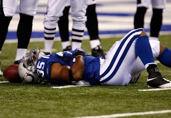 INDIANAPOLIS, IN - AUGUST 20: Running back Chad Simpson #35 of the Indianapolis Colts lays on the field injured against the Philadelphia Eagles at Lucas Oil Stadium on August 20, 2009 in Indianapolis, Indiana. (Photo by Scott Boehm/Getty Images)