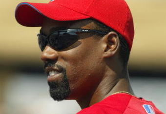 CLEARWATER, FL - MARCH 13:  Doug Glanville #6 of the Philadelphia Phillies looks on during the game against the Tampa Bay Devil Rays at Bright House Networks Field on March 13, 2004 in Clearwater, Florida.  The Devil Rays won 6-5.  (Photo by Harry How/Getty Images)
