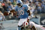 NASHVILLE, TN - NOVEMBER 15:  Quarterback Vince Young #10 of the Tennessee Titans is tackled by Reggie Corner #27 of the Buffalo Bills in their NFL game at LP Field on November 15, 2009 in Nashville, Tennessee.    (Photo by John Sommers II/Getty Images)