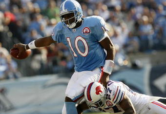 NASHVILLE, TN - NOVEMBER 15:  Quarterback Vince Young #10 of the Tennessee Titans is tackled by Reggie Corner #27 of the Buffalo Bills in their NFL game at LP Field on November 15, 2009 in Nashville, Tennessee.    (Photo by John Sommers II/Getty Images)